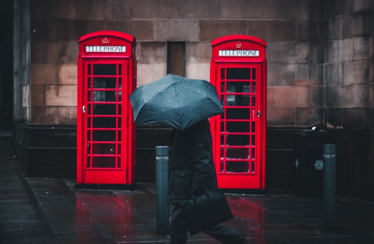 Two red British telephone booths.