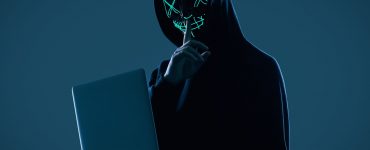 cyber criminal committing digital fraud